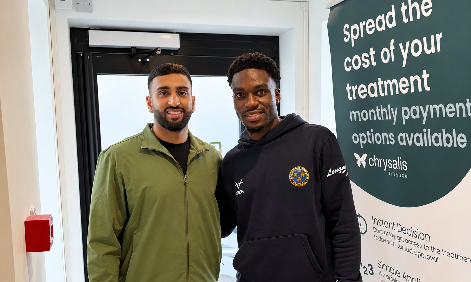 Dr Cameron Bagry with footballer Kevin Berkoe at the practice